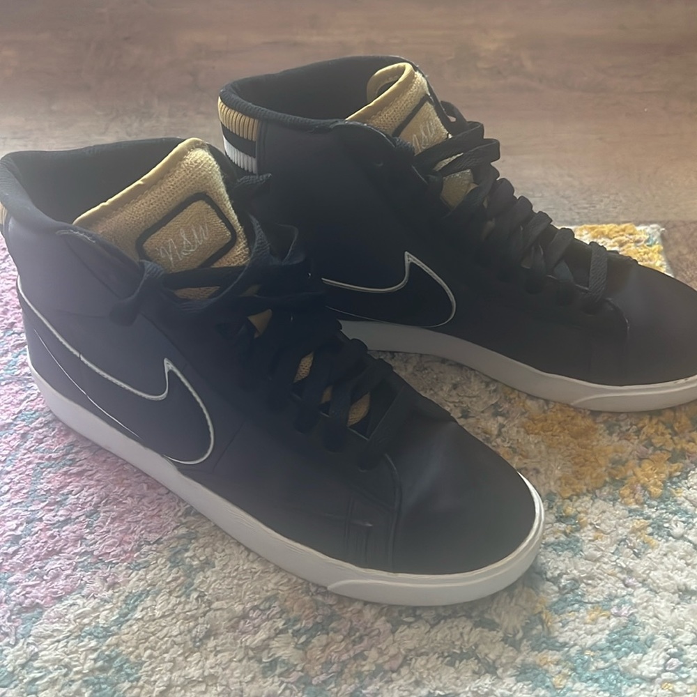 Nike women’s black and gold high tops size 7.5